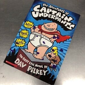 The Adventures of Captain Underpants by: Dav Pilkey, paperback book